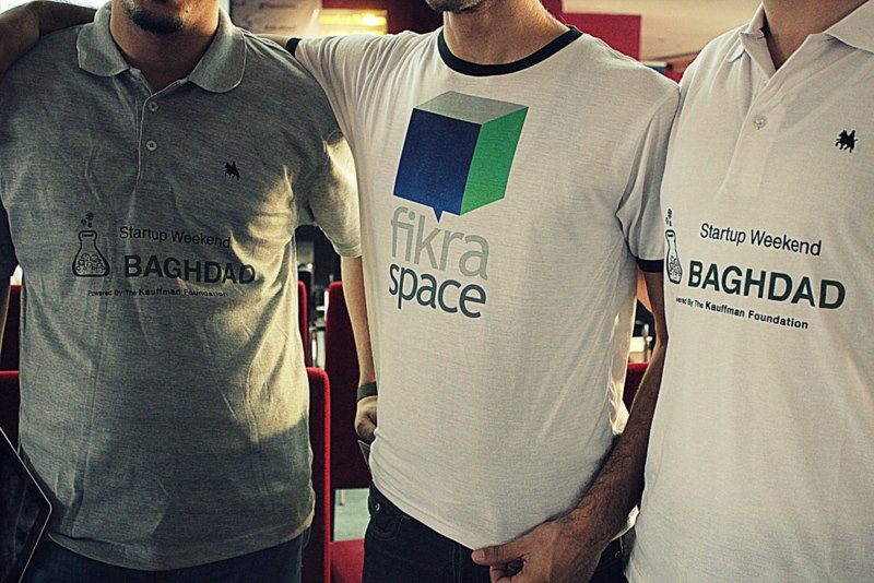 Posing to represent the collaboration between FikraSpace and Startup Weekend Baghdad!